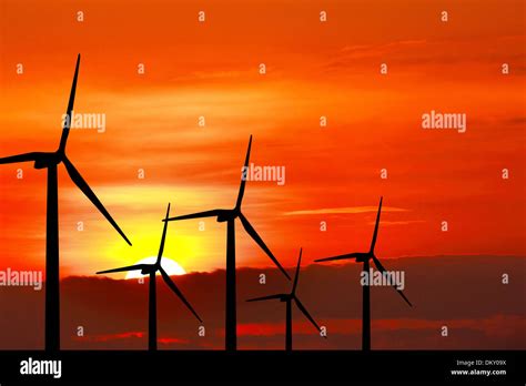 Wind turbine silhouette on sunset background Stock Photo - Alamy