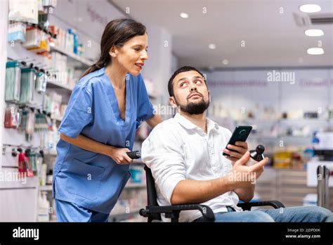 Druggist Helping Woman To Choose Medicine Stock Photo Alamy