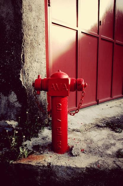 Premium Photo Red Fire Hydrant Against Shutter