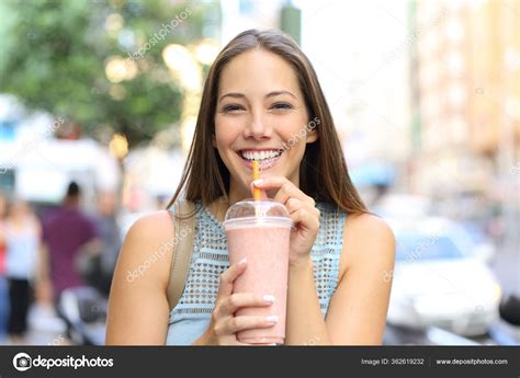 Front View Portrait Happy Girl Looking Camera Drinking Milkshake Street