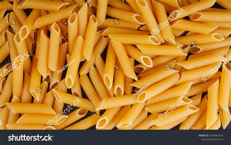 Raw Italian Penne Rigate Macaroni Pasta Stock Photo