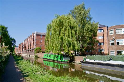 New Buildings And Moored Barge On The Oxford Canal Editorial Photo