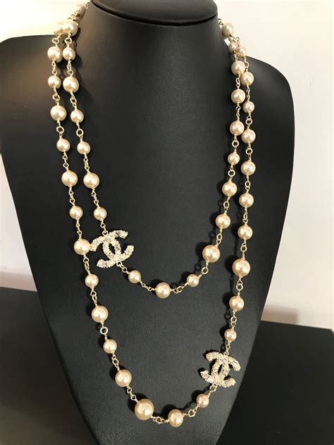 An Authentic Chanel Long Pearl Necklace With Cc Logos With Seed Pearls