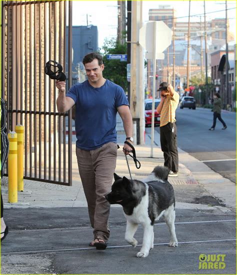 Henry Cavill Shows Off Buff Biceps Taking His Dog For A Walk Photo