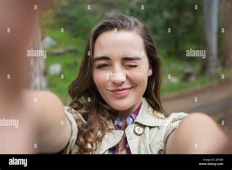 Smiling Woman Taking Selfies Stock Photo Alamy