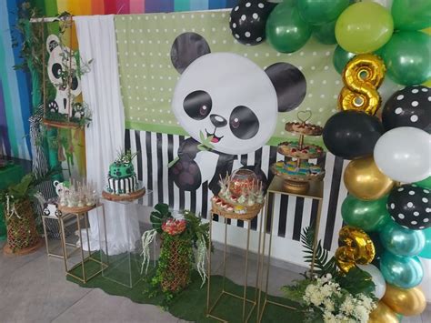 A Panda Bear Themed Birthday Party With Balloons Cake And Desserts On