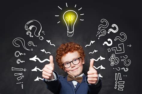 Premium Photo | Clever boy pupil in glasses with lightbulb on ...