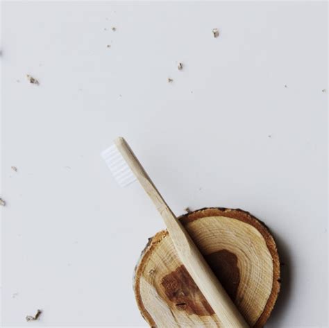 Photo Of Wooden Toothbrush On Top Of Wooden Plank · Free Stock Photo