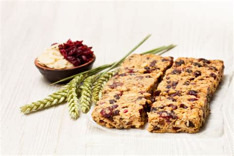 Healthy Protein Granola Bars With Dried Berries And Nuts On Whi Stock