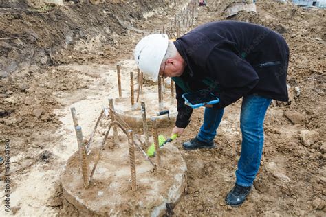 Piles Cleaning Engineer Clears A Place For Pile Integrity Test Pile