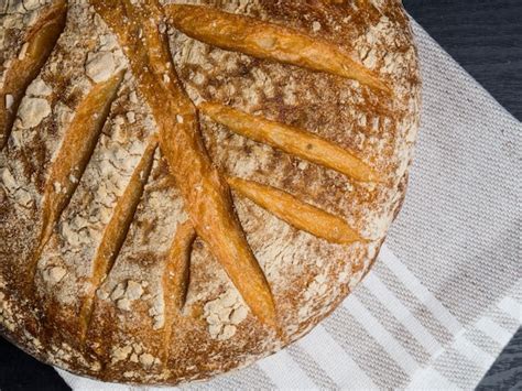 Premium Photo Freshly Baked Traditional Bread On Wooden Table