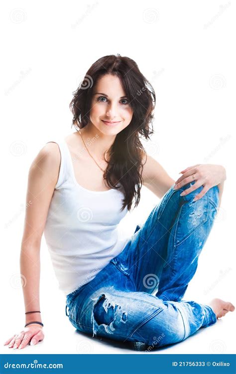 A Man In Jeans Is Sitting On The Toilet In A Public Toilet Stock Photo