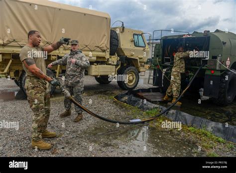 U S Army Spc Devon Duncan And Sgt Stephen Ellison Assigned To The