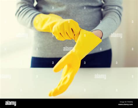 Close Up Of Woman Wearing Protective Rubber Gloves Stock Photo Alamy