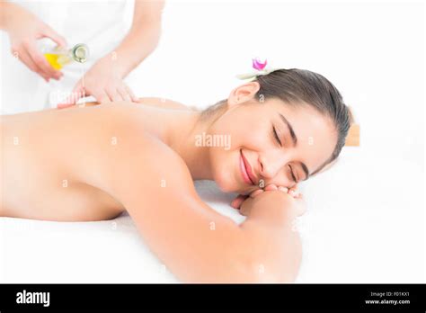 Beautiful Brunette Enjoying An Oil Massage Stock Photo Alamy