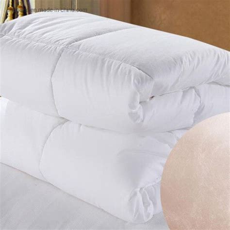 Two White Pillows Stacked On Top Of Each Other