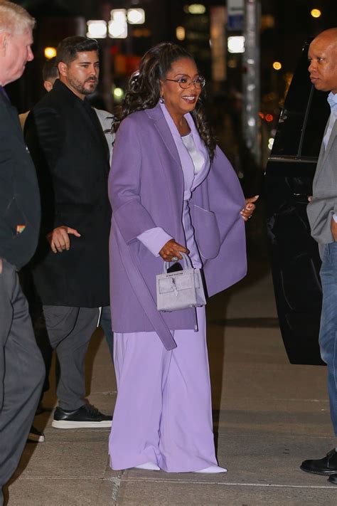 Oprah Winfrey in a Light Purple Outfit in New York 12/14/2023 • CelebMafia