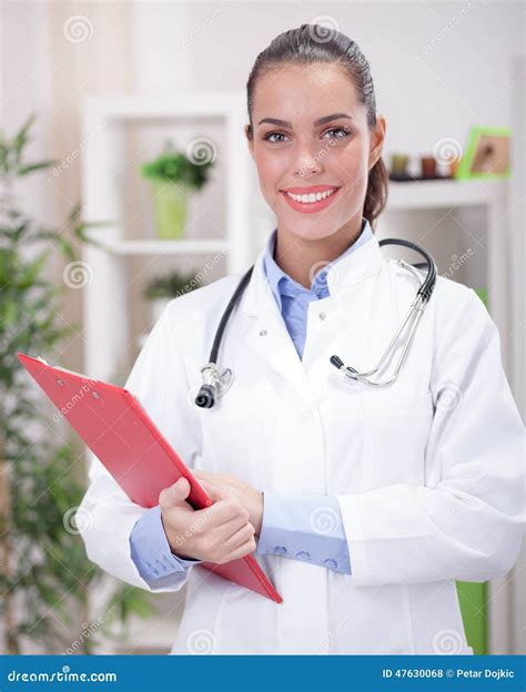 Portrait Of A Friendly Smiling Female Doctor Stock Photo Image Of