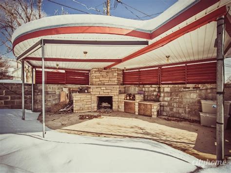 An Outdoor Covered Patio With A Fire Place