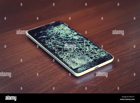 black smartphone  broken screen stock photo alamy