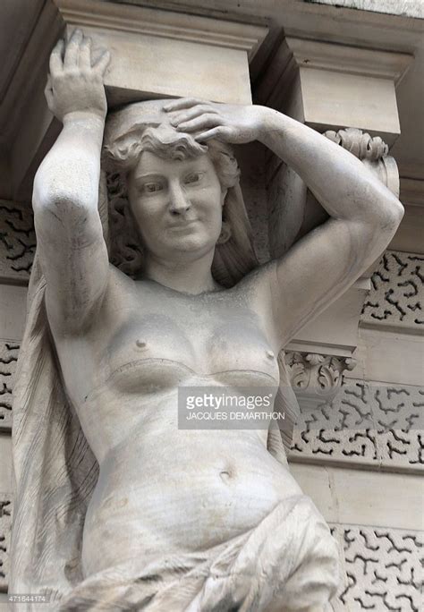 A Photo Taken In Shows A Caryatid Sculpture On A Building On