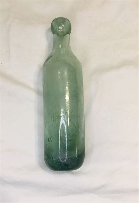 Old Green Thick Glass Round Bottomed Bottle With E R And Co Trade Mark On It Antique