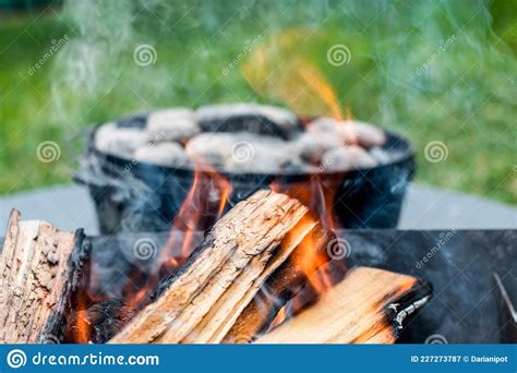 Dutch Oven Camp Cooking With Coal Briquettes Beads On Top Campfire