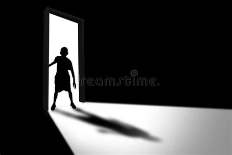 Kid Enters Dark Room Concept Of Unknown And Fear Stock Photo Image