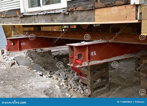 Old House Resting on Girders and Timbers Stock Image - Image of ...