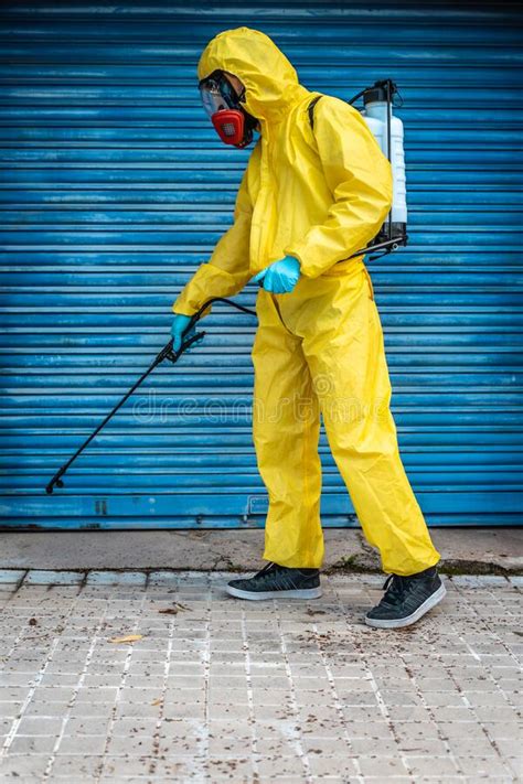 Coronavirus A Sanitation Worker Wearing A Mask And Cleaning The