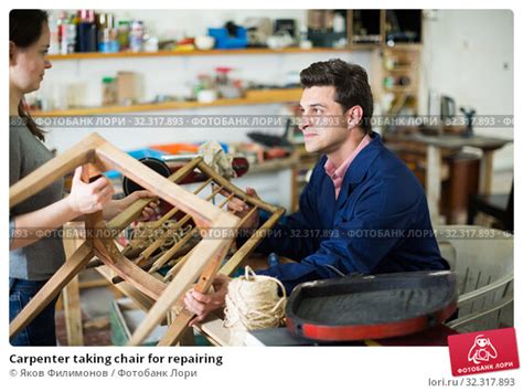 Carpenter taking chair for repairing Стоковое фото 32317893