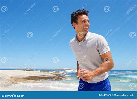 Happy Middle Aged Man Walking On The Beach Stock Photo Image Of