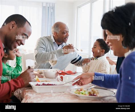 African American family enjoying Thanksgiving dinner Stock Photo - Alamy