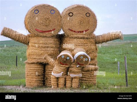 Hay art, a family constructed out of hay bales along a North Dakota road. Photograph Stock Photo ...