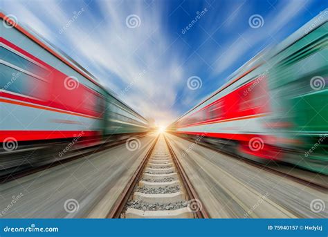 Two Modern High Speed Train With Motion Blur Under The Blue Sky Stock