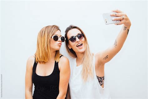 Two Women Taking A Selfie With Your Mobile Phone By Stocksy