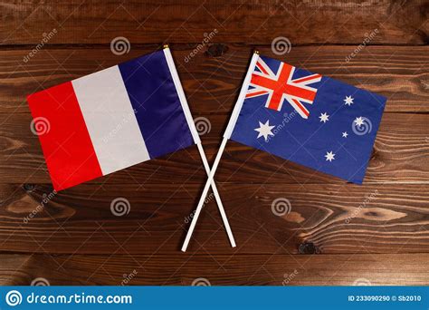 Flag Of France And Flag Of Australia Crossed With Each Other The Image