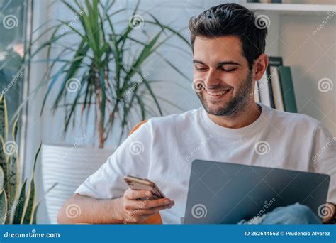 Man At Home Working With Laptop And Mobile Stock Image Image Of