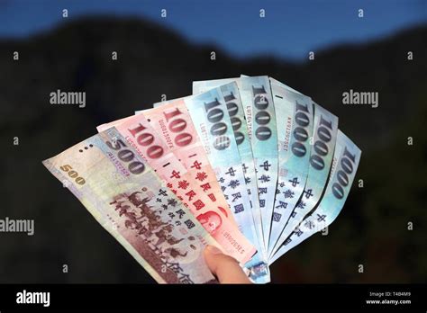 New Taiwan Dollars Currency Hand Holding 100 500 And 1000 Ntd