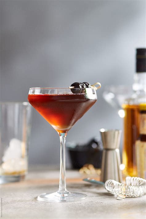 "Glass Of Tasty Manhattan Cocktail." by Stocksy Contributor "Martí Sans ...