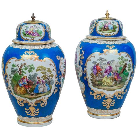 Pair Of Meissen Style Blue Porcelain Covered Jars With Painted Scenes