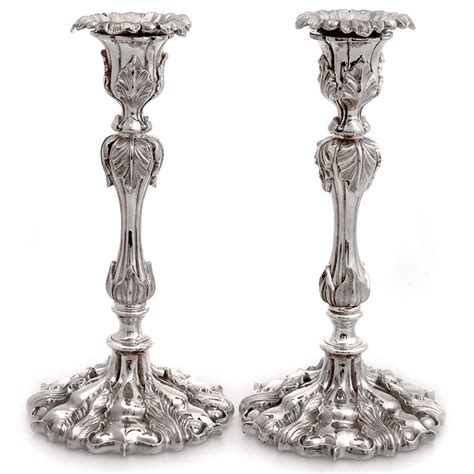 Pair Of Elkington Co Silver Plated Candle Sticks Decorated With