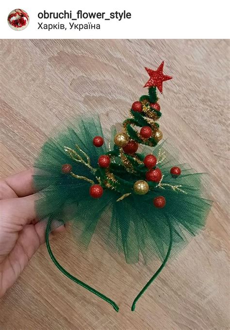 A Hand Is Holding A Green Tulle Christmas Tree Headband