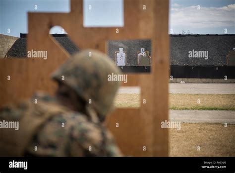 Cpl Brandon Tallent Engages A Target During A Course Of Fire In The