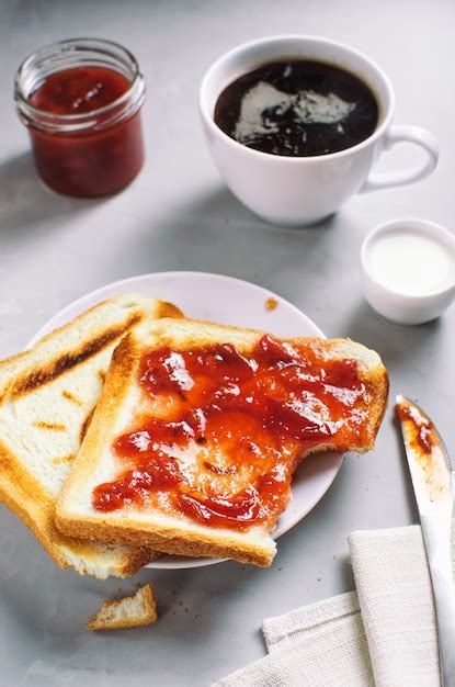 Premium Photo | Delicious breakfast with coffee and toast with jam