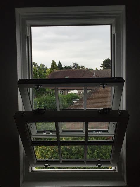 White Upvc Sliding Sash Window With Astragal Bars Installed By