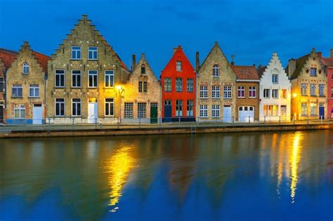 Premium Photo | Night bruges canal with beautiful colored houses