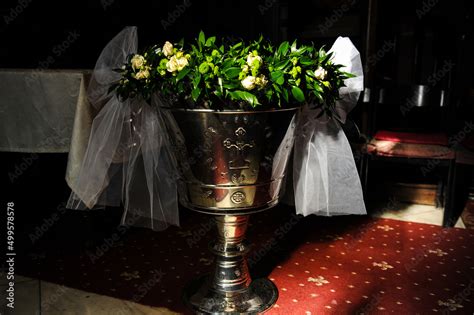 Baptismal font. Baptismal font adorned with flowers for baptism ...