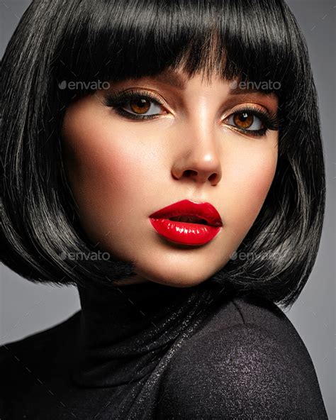 Beautiful Brunette Girl With Red Lips And Black Bob Hairstyle Stock