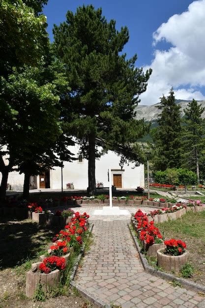 Premium Photo A Garden In Front Of A Small Church In Campo Di Giove A